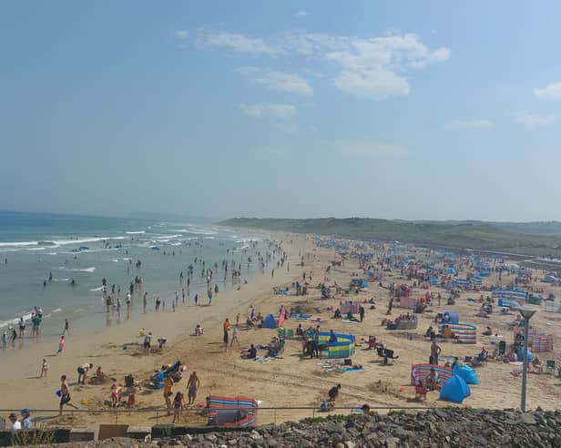 Summer crowds on Portrush’s East Strand