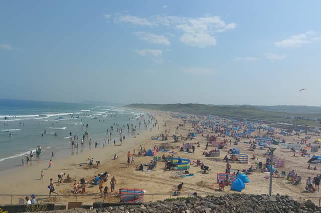 Summer crowds on Portrush’s East Strand