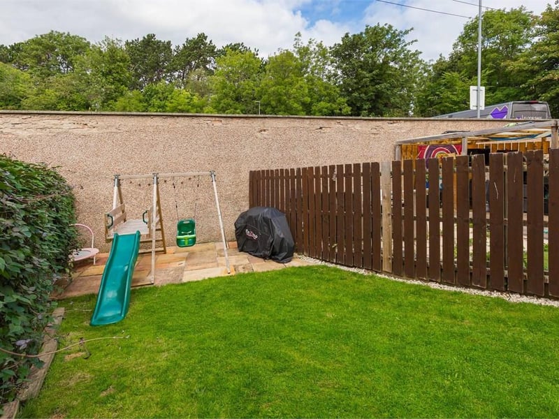 To the rear is a fully enclosed and wonderfully private garden comprising a lawn, paved patio and garden shed.
