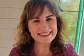 Louise Burchall's interest in laughter yoga developed due to her late father's illness. 