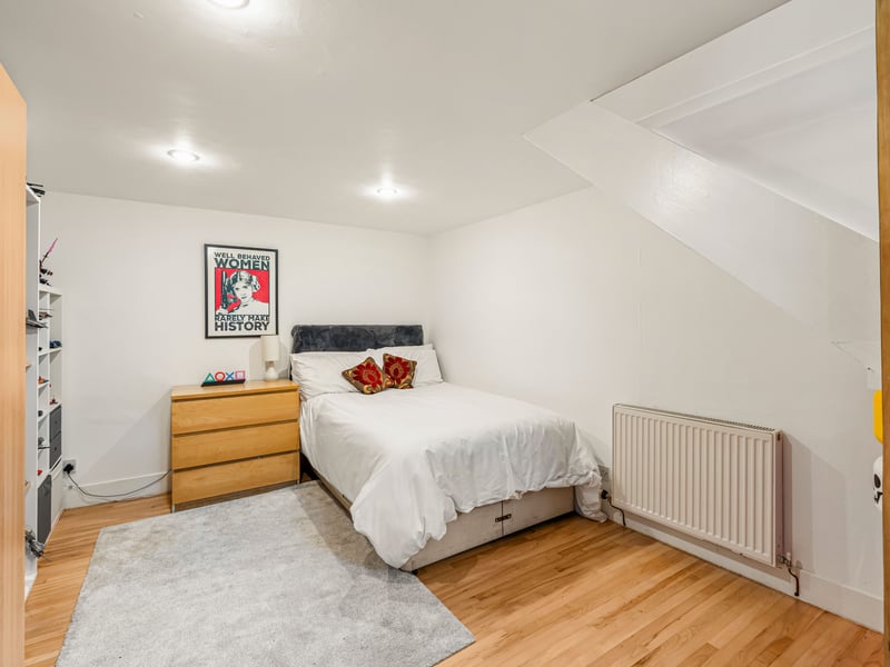 Two further double bedrooms are situated on the main level, alongside a spacious family bathroom. A fourth double bedroom on the lower ground floor provides further adaptable accommodation, ideal for guests, older children or those working from home.