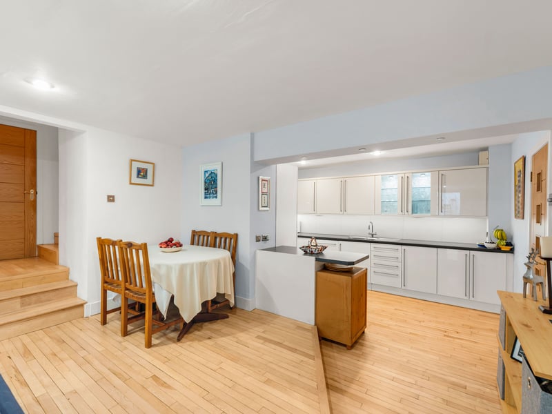 The kitchen is well appointed with a generous range of contemporary cabinetry, excellent worktop space and integrated appliances, while a separate utility room provides valuable additional storage and laundry facilities.