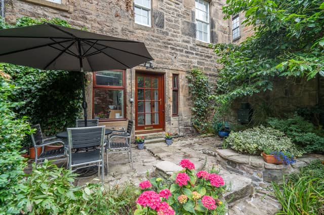 Tucked away behind its own private gate, moments from the vibrant atmosphere of the Grassmarket, this unique B-Listed garden flat offers a rare combination of tranquillity, character and generous living space in the very heart of Edinburgh's historic Old Town.