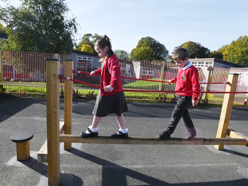 Key Stage One pupils enjoy their new Trim Trail. 
