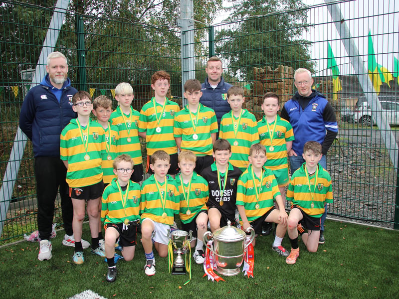 NEWTOWN Emmets U12 Boys winners of the Micéal Murphy Memorial Match held after the official opening of  the 4G pitch pictured with coaches Liam Carragher, Dorsey Emmet's Chairperson Conor Campbell and Coach Shane Rock. LB4072