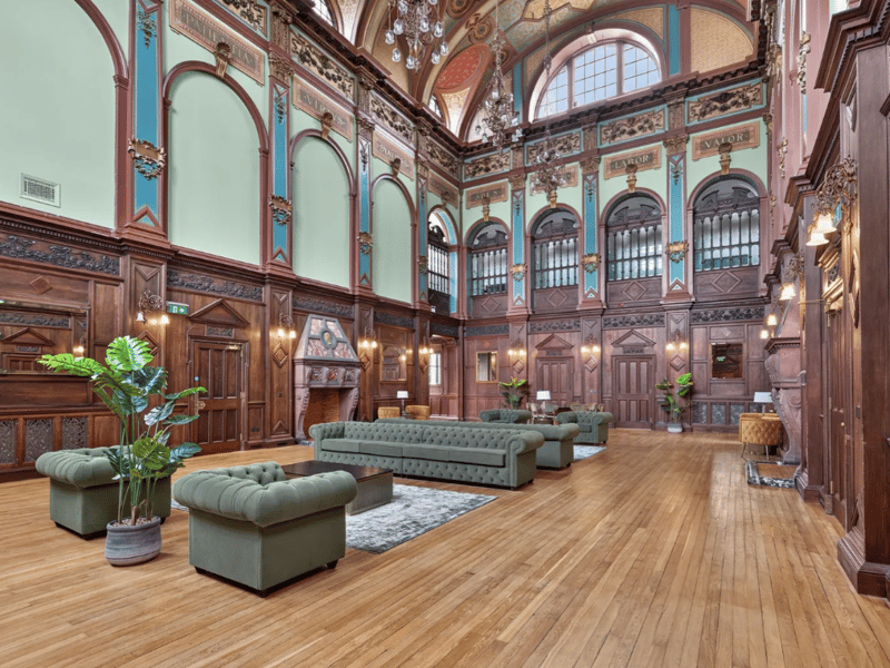 At the heart of the development lies the magnificent Great Hall, an impressive Baronial-style space showcasing rich oak panelling, classical pilasters, gilded cornicing and dramatic semi-circular windows beneath an intricately detailed ceiling.