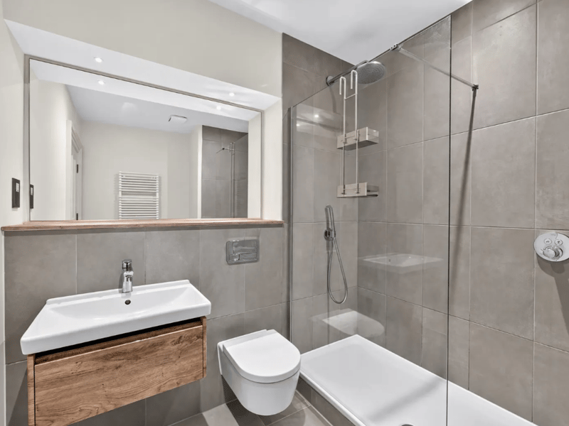 The stylish ground-floor bathroom. There is also a separate first-floor shower room, and high-specification fixtures and fittings throughout. The property also benefits from gas central heating.