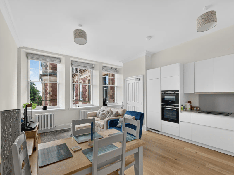 The modern well-equipped kitchen includes a range of Siemens integrated appliances, and plenty of space for dining.