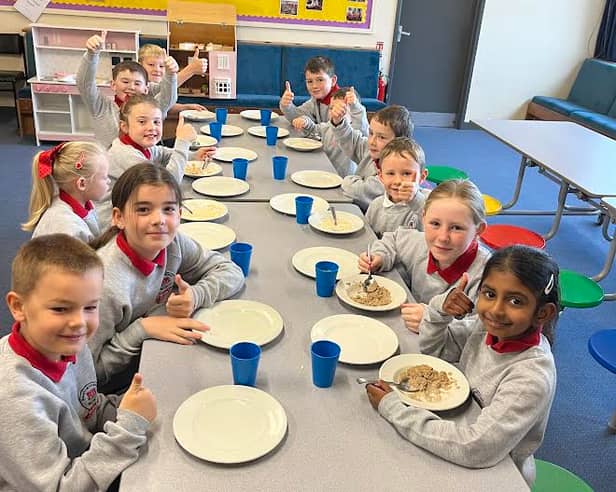 It's a 'thumbs up' from the children at Newtownstewart Model Primary School s they enjoy their new Breakfast Club