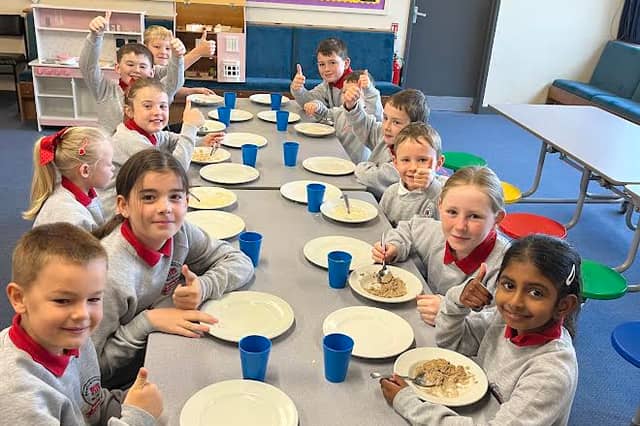 It's a 'thumbs up' from the children at Newtownstewart Model Primary School s they enjoy their new Breakfast Club