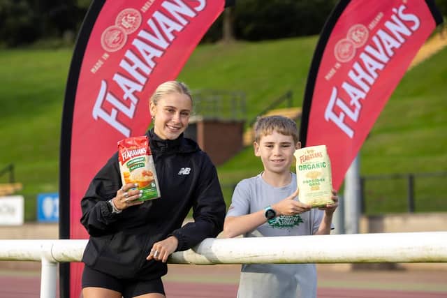 Last year’s League winner Jackson Nellis from DH Christie Memorial Primary School with League Ambassador, Kirsti Foster at the Mary Peter’s Track for the launch of the 2026-27 Flahavan’s Athletics NI Primary School Cross Country League.
