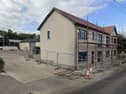 One of the planning applications sought permission for the retention of extension and alterations to an existing dwelling and its adjoining unused shop floor, to provide six self-contained apartments.