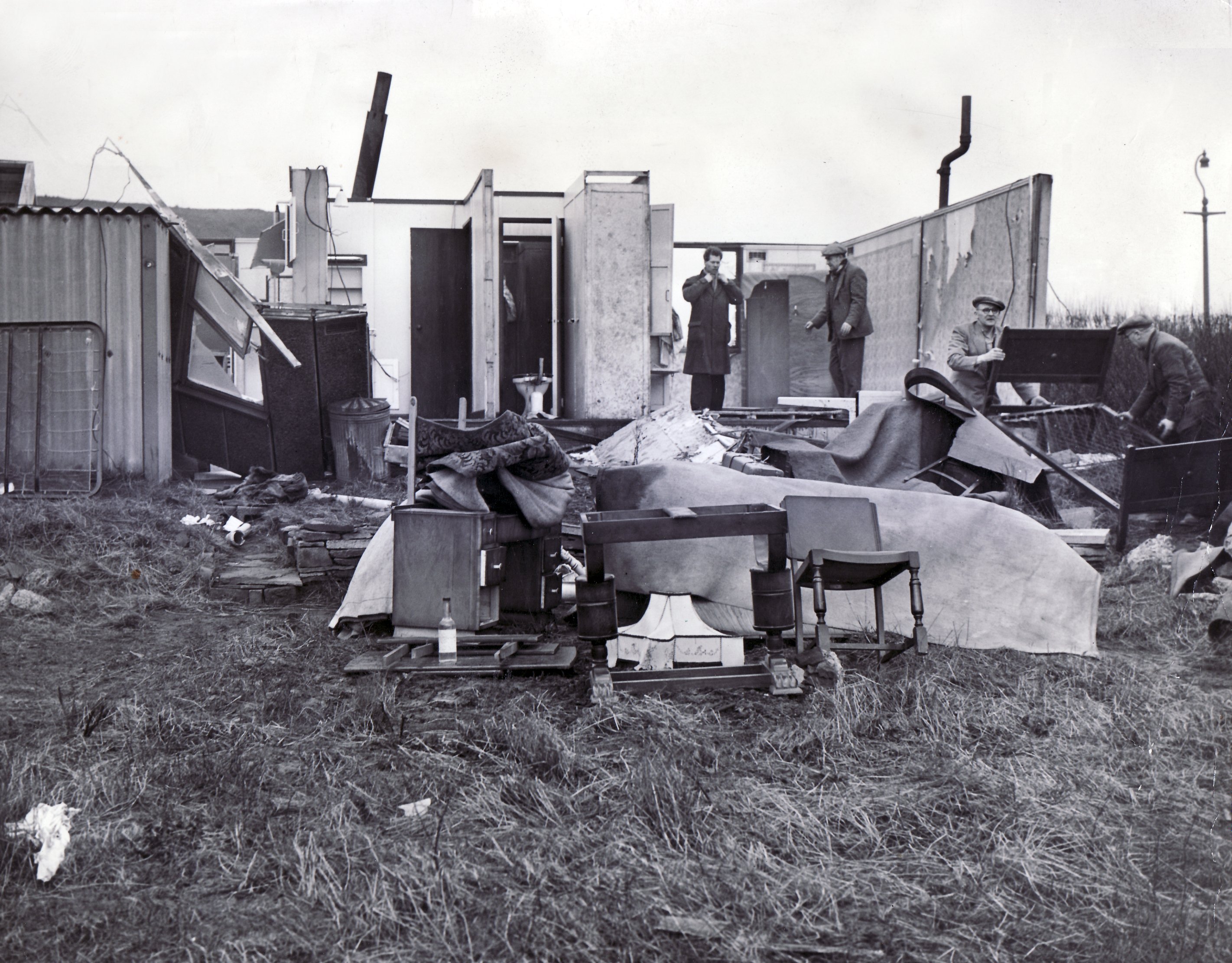 Friends and neighbours gathered round to help Mr & Mrs Alan Jenkinson after their prefab home was blown down by gales at 45 Standish Road, Shirecliffe, Sheffield - 2nd March 1956