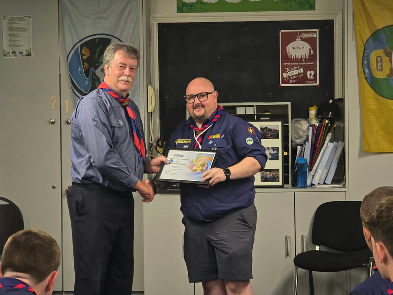 .Pat English presenting 2 year service award to Chris Gregory
