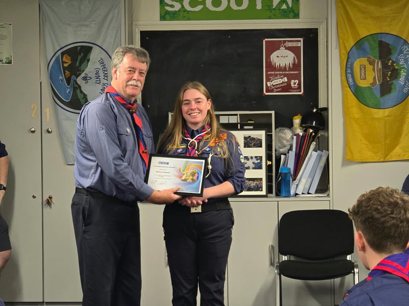 Pat English presenting 10 year Service award to Nykki Oakley