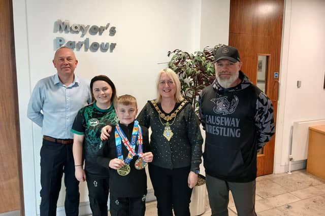 Leon Williamson pictured with Mayor of Causeway Coast and Glens, Councillor Dawn Huggins, his mum, Melanie and coach Peter McClay from Team Ryano Causeway; also included is Councillor Philip Anderson.