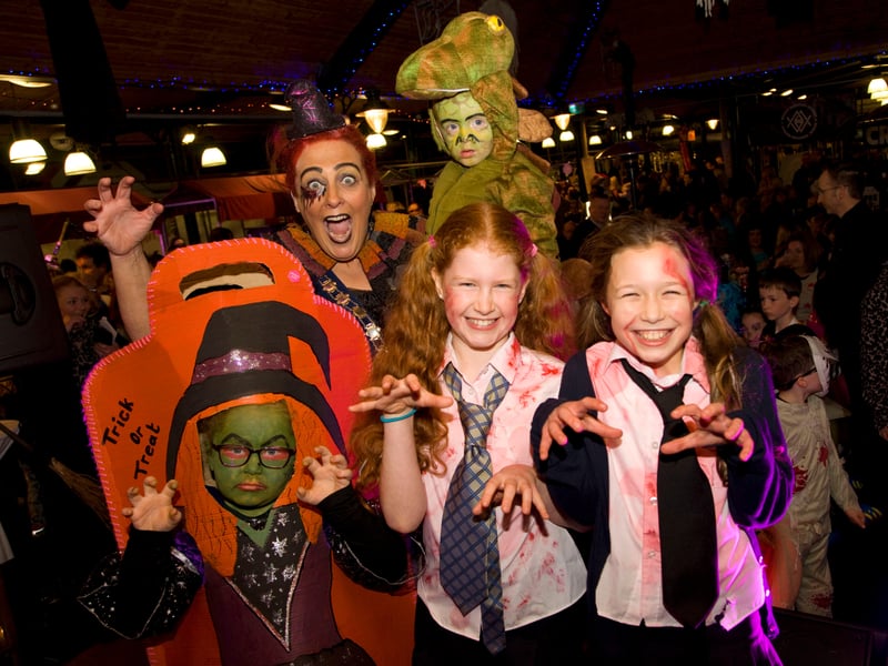 GILLIAN Fitzpatrick, Chairperson Newry Mourne and Down District Council pictured with some of the fancy dress winners enjoying the spooktacular Newry Twilight Market 10 years ago. NM4534