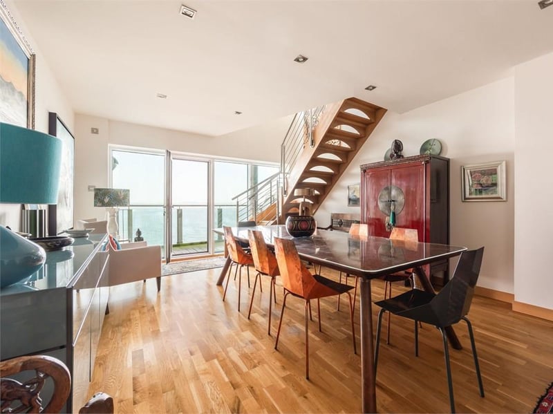 The dining room opens directly onto the private balcony. There is space to entertain around a proper dining table and to relax in the separate living room.