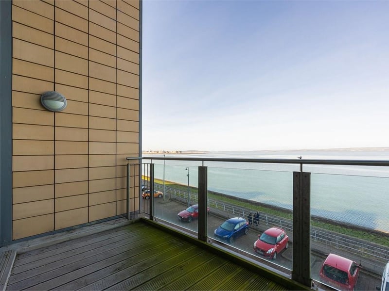 With an internal area 156m² / 1,679 sq ft, this waterfront property has two double bedrooms, two reception rooms, two additional box rooms with dressing storage or home office potential, this private balcony, two en-suites, an allocated underground parking space, and lift access. 
