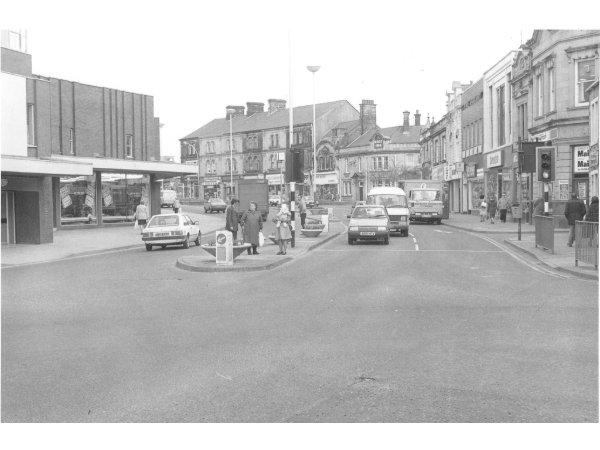 Photograph shows St. James's Street taken from the junction with Manchester Road, looking towards Church Street. The photograph was taken prior to the road becoming pedestrianised.