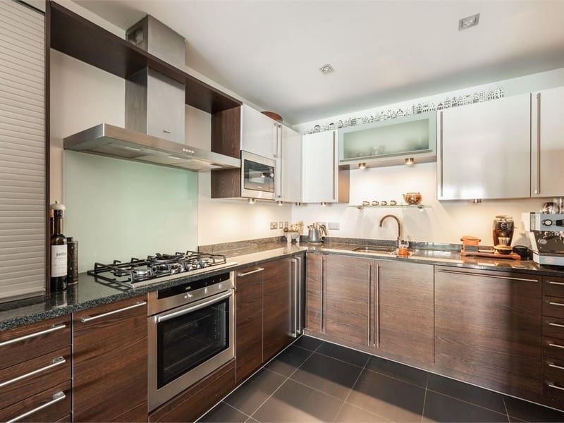 The kitchen sits off the dining room, and a separate utility room keeps laundry away from the cooking space. A guest WC adds everyday convenience. 