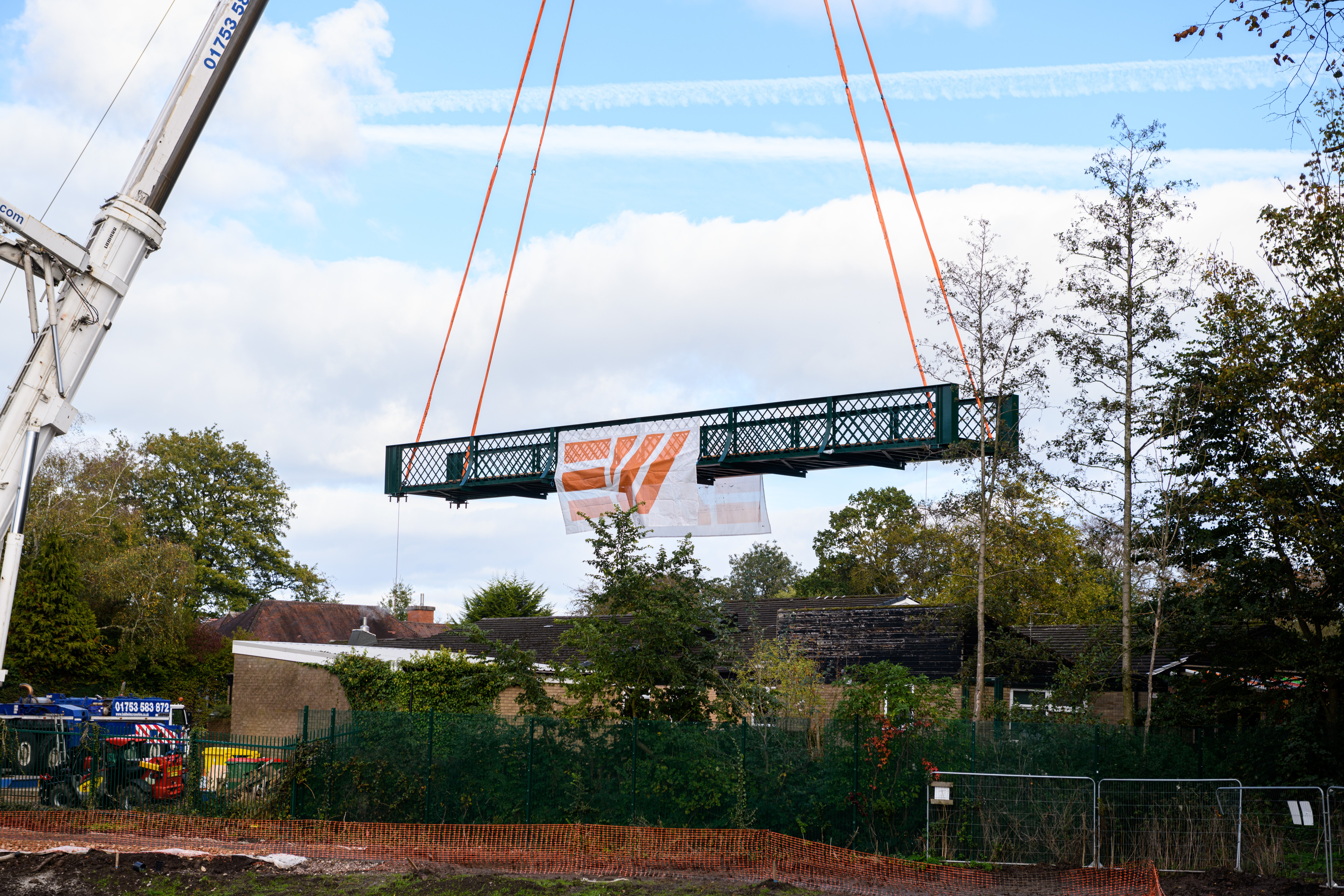 Serpentine Lake bridge is lowered into place by crane at Moor Park, Preston. Photo: Kelvin Lister-Stuttard