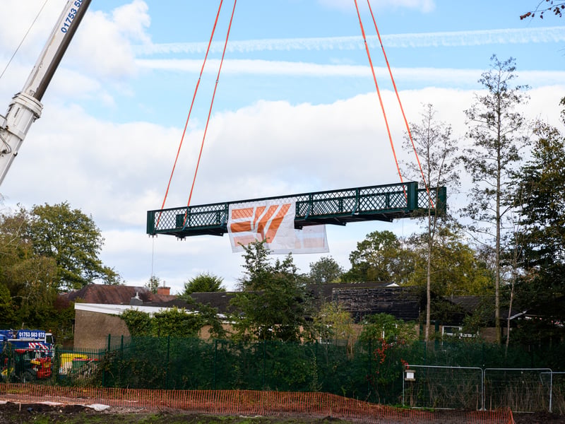 Serpentine Lake bridge is lowered into place by crane at Moor Park, Preston. Photo: Kelvin Lister-Stuttard