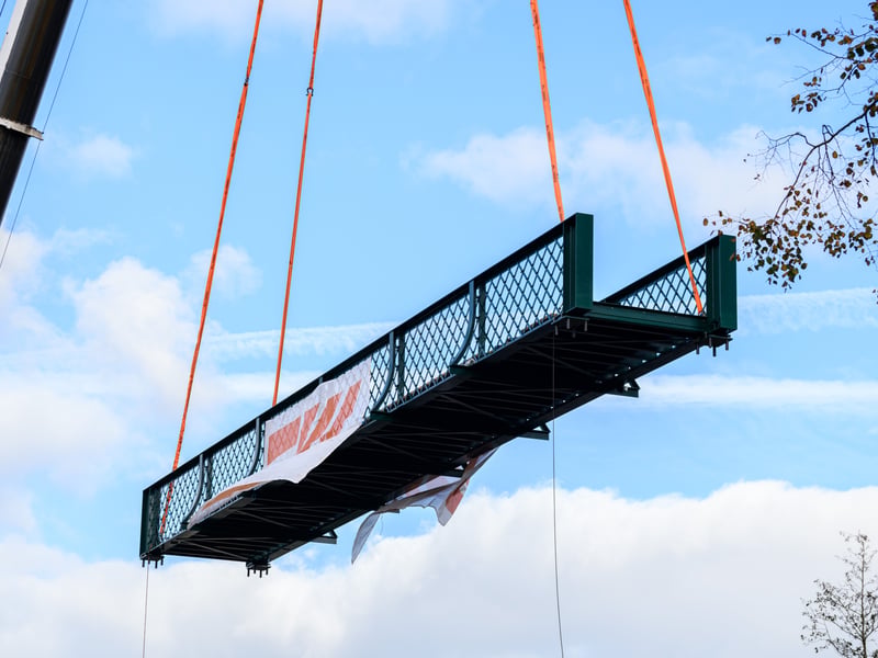 Serpentine Lake bridge is lowered into place by crane at Moor Park, Preston. Photo: Kelvin Lister-Stuttard
