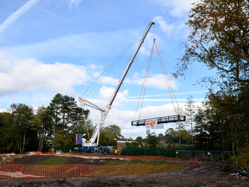 Serpentine Lake bridge is lowered into place by crane at Moor Park, Preston. Photo: Kelvin Lister-Stuttard