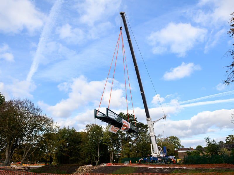 Serpentine Lake bridge is lowered into place by crane at Moor Park, Preston. Photo: Kelvin Lister-Stuttard