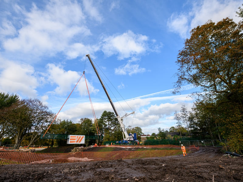 Serpentine Lake bridge is lowered into place by crane at Moor Park, Preston. Photo: Kelvin Lister-Stuttard