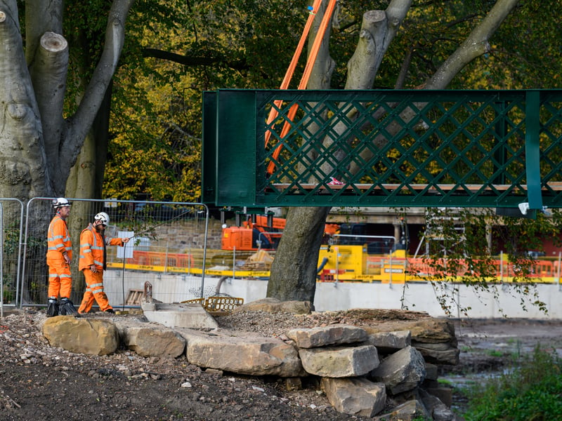 Serpentine Lake bridge is lowered into place by crane at Moor Park, Preston. Photo: Kelvin Lister-Stuttard