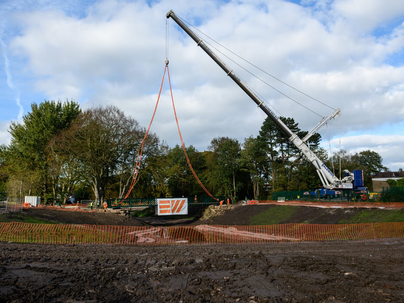 Serpentine Lake bridge is lowered into place by crane at Moor Park, Preston. Photo: Kelvin Lister-Stuttard