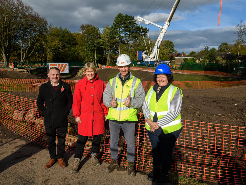 (l-r) Cllr Connor Dwyer, Cllr Valerie Wise, Gregg Brett, Contract Manager Eric Wright Civil Engineering and Sarah Ward Project Manager FWP ltd after the Serpentine Lake bridge is lowered into place by crane at Moor Park, Preston. Photo: Kelvin Lister-Stuttard