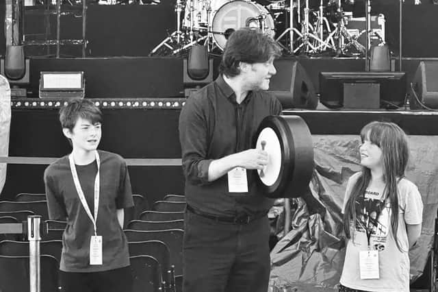 MacDara Ó Conaola with his children Seán, 13, and Michelle, 10 on stage at the Tocati festival