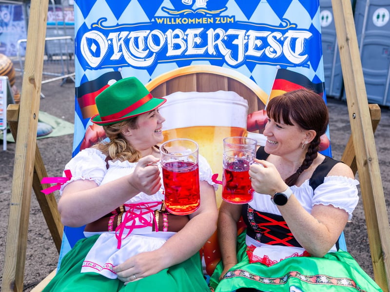 Friends raise two rather large steins