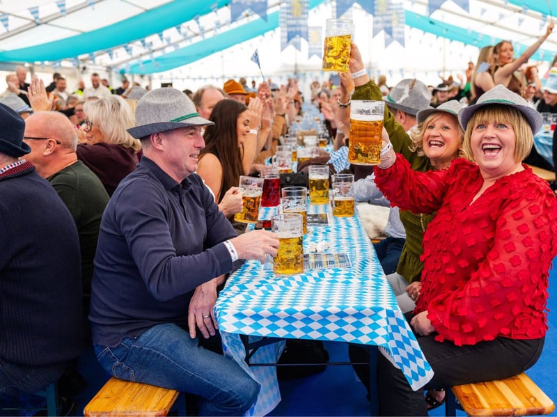 These revellers raise a stein of beer