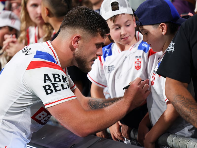 Brad O'Neill meeting young fans after the full-time hooter