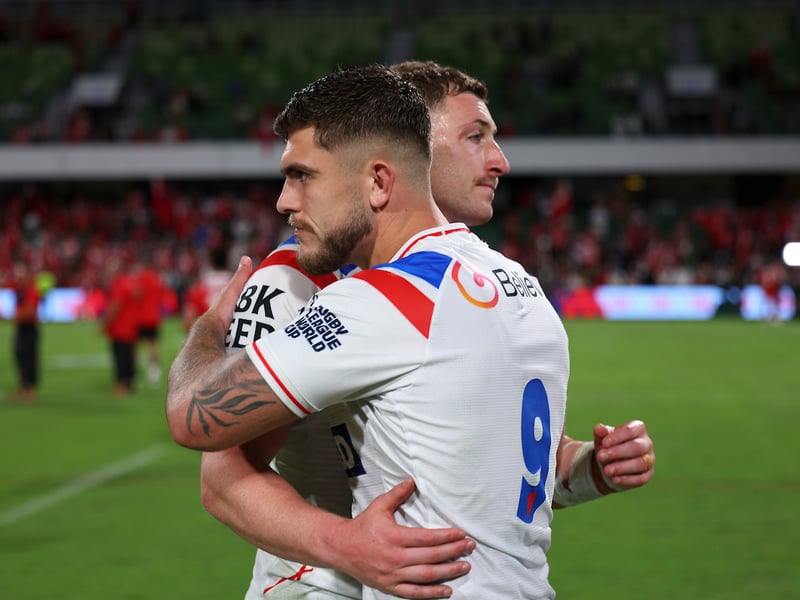 Brad O'Neill consoles Max King after England's defeat to Tonga