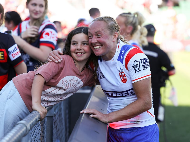 England and Wigan winger Anna Davies meets young fans after the game
