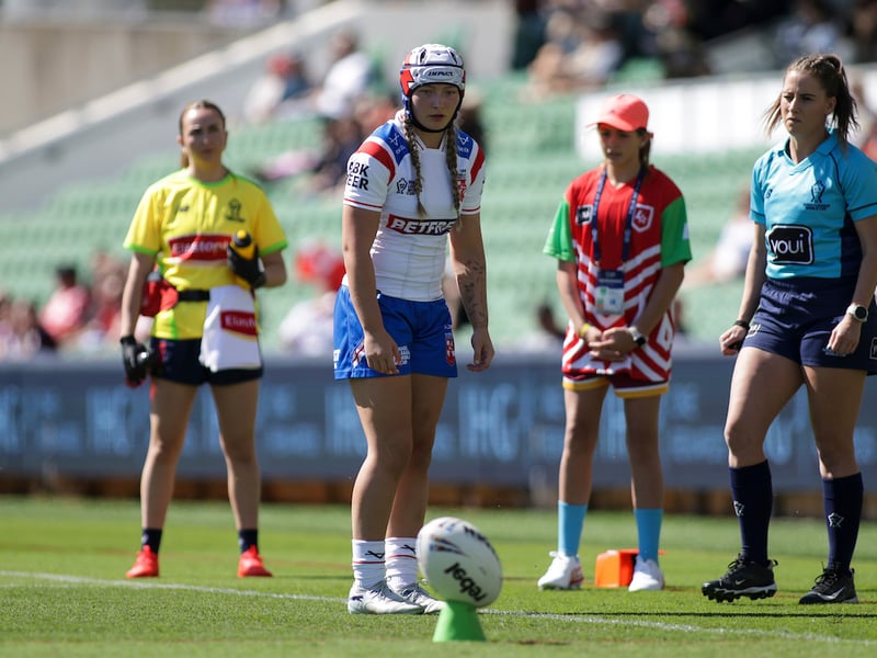 Wigan's Izzy Rowe kicking a goal for England
