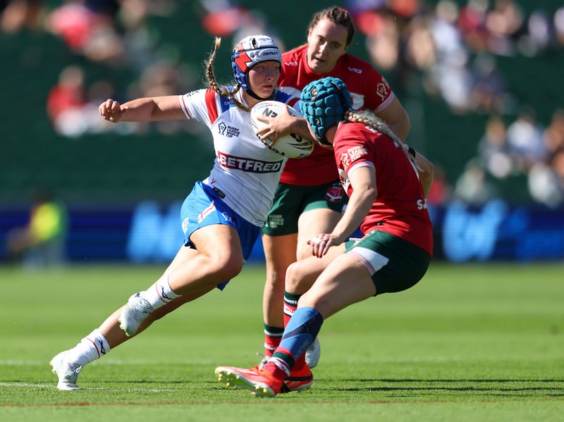 Izzy Rowe takes on the Welsh defence