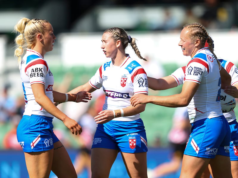 Jasmin Strange (left), Georgia Wilson (centre) and Anna Davies (right) celebrate an England try