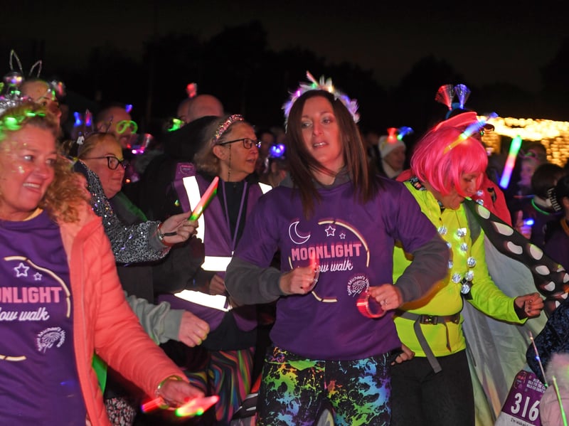 Fundraisers take part in a warm-up session before setting off on the walk in support of Saint Michael’s Hospice