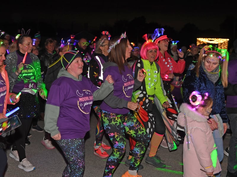 Fundraisers take part in a warm-up session before setting off on the walk in support of Saint Michael’s Hospice