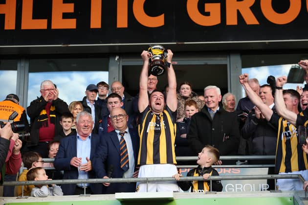Crossmaglen Rangers captain Callum Cumiskey lifts the Gerry Arthur Cup.