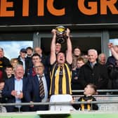 Crossmaglen Rangers captain Callum Cumiskey lifts the Gerry Arthur Cup.