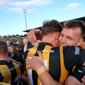 BROTHERS IN ARMS: O'Neill brothers Oisin and Rian embrace at the final whistle in Armagh.