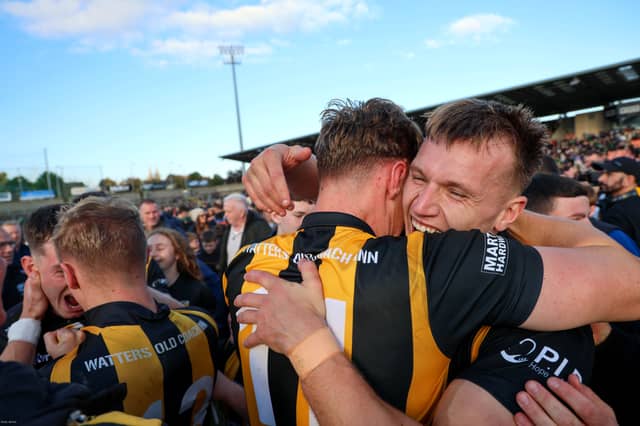 BROTHERS IN ARMS: O'Neill brothers Oisin and Rian embrace at the final whistle in Armagh.