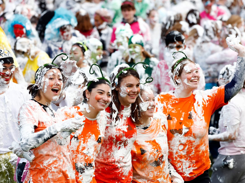 Third-year students lined the foaming arena to cheer on their “children”, often dressed up the same to signify their “family” ties.